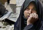 Iraqi woman looking distressed - still from film about the state of Iraq at time of aledged handover by occupying US troops.